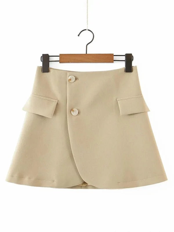 Tan A-line skirt with faux flap pockets and double button closure.