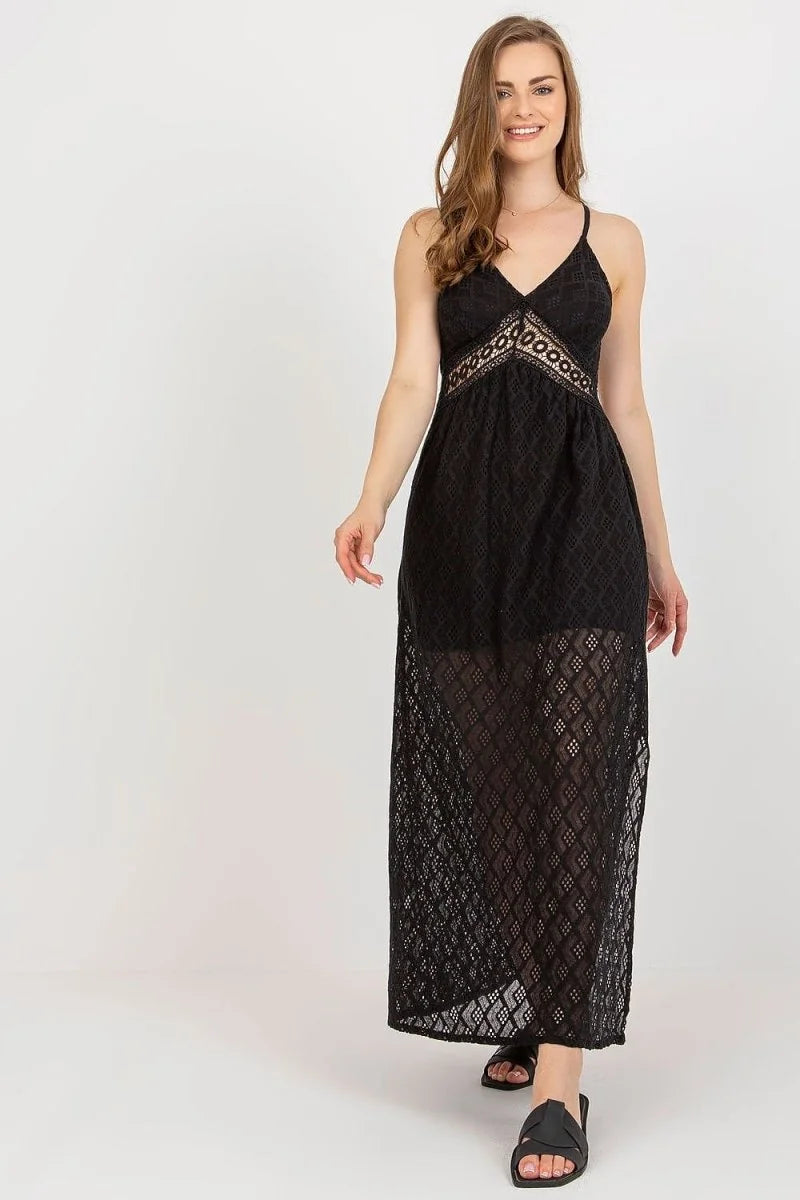 Black lace maxi dress with V-neck, fitted waist, and sheer diamond pattern skirt on model.