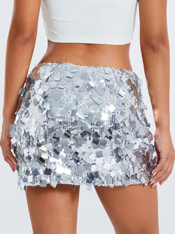 Silver sequin mini skirt with a textured, shimmering finish on model.