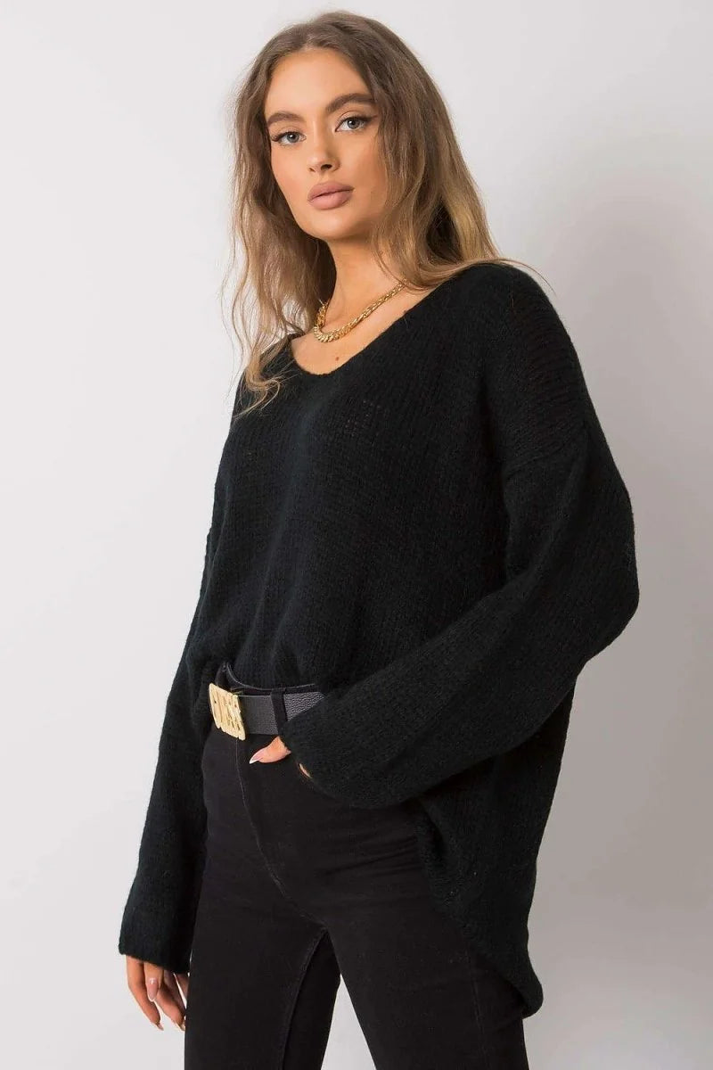 Black V-neck sweater with a textured knit and relaxed fit, worn with a black belt.