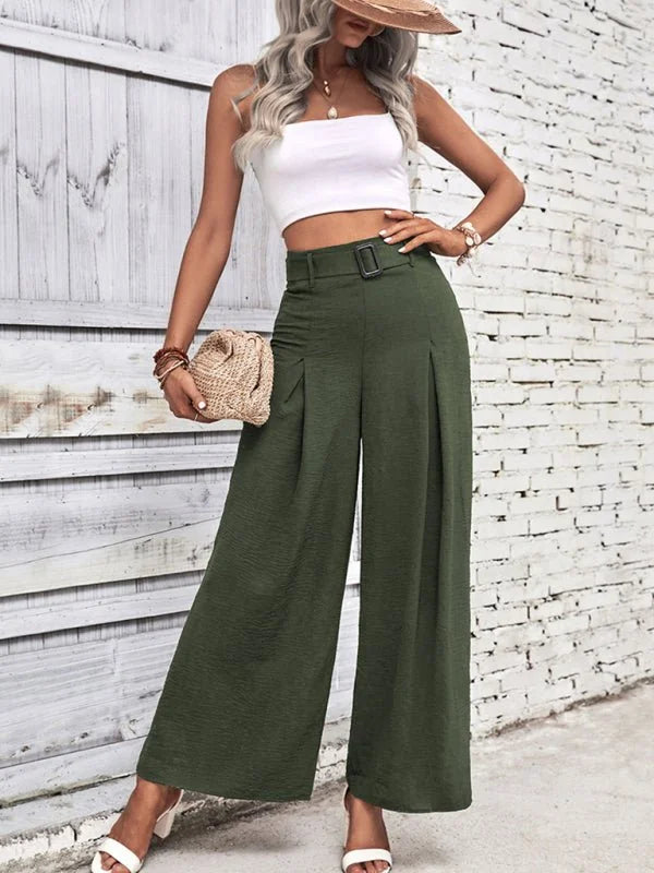 Olive green wide-leg pants with textured fabric and a belted waist, shown on a model.