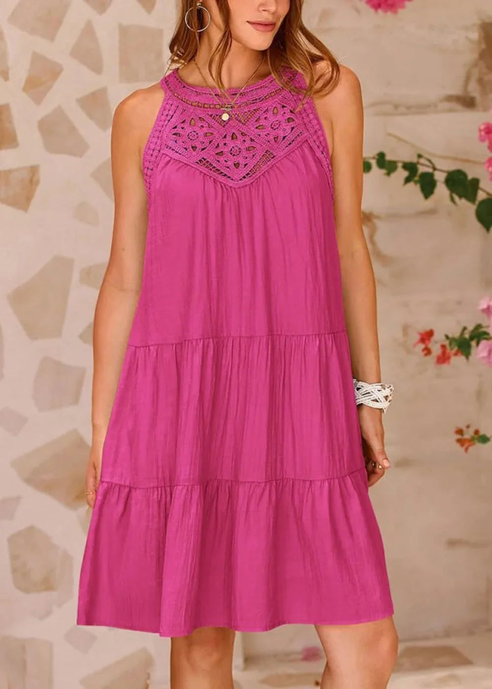 Fuchsia tiered dress with crochet neckline, on model.