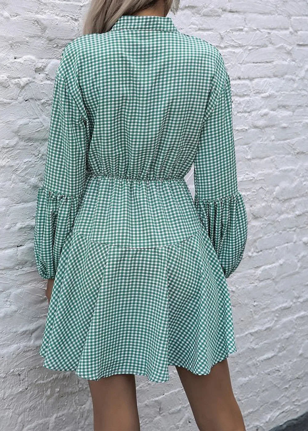 Green and white gingham print dress with cinched waist and puffed sleeves, shown from the back.