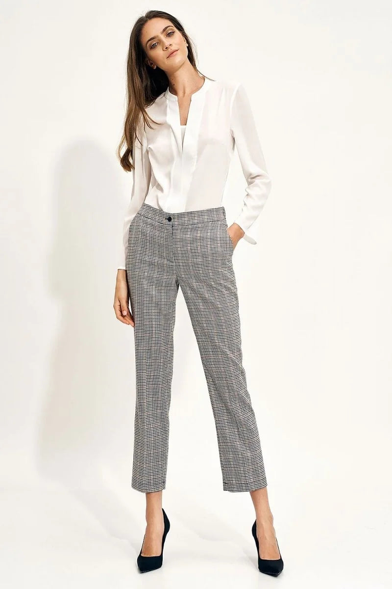 Gray and white checkered pants with a regular fit and a button closure, shown on a model.