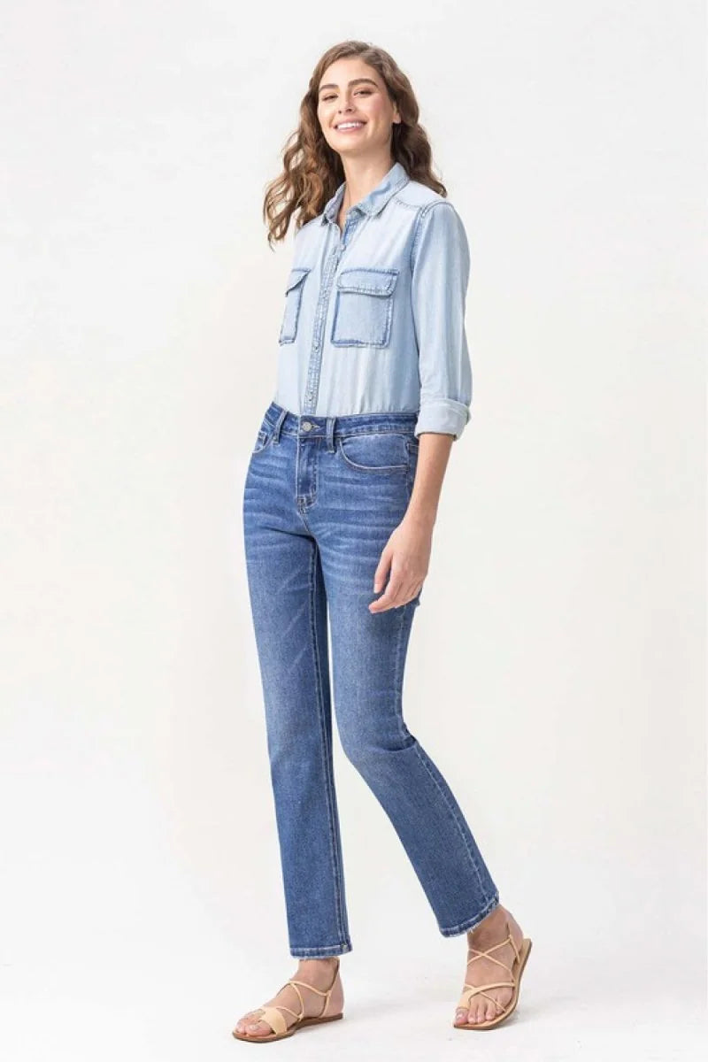Light wash denim jeans with a regular fit on a model.