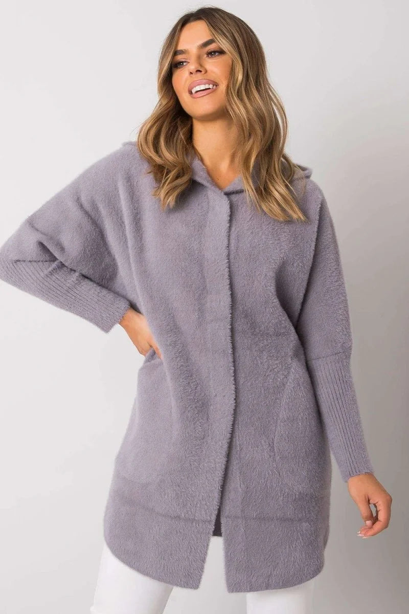 Light purple fuzzy hooded cardigan with ribbed cuffs and pockets on a model.
