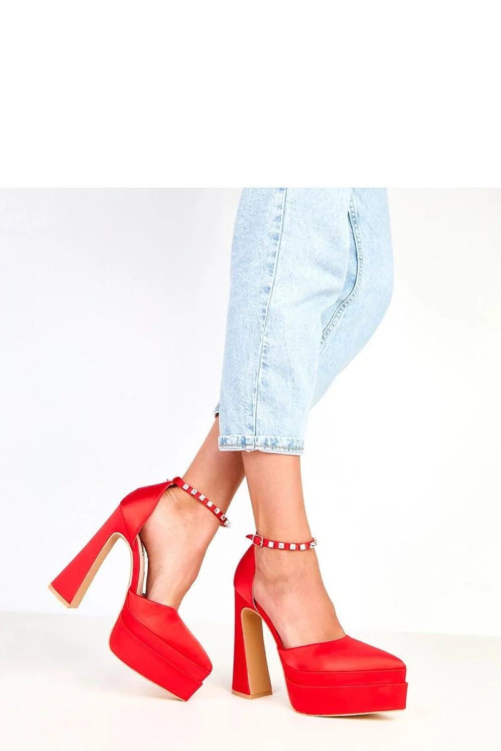 Red satin platform heels with studded ankle straps and block heels.