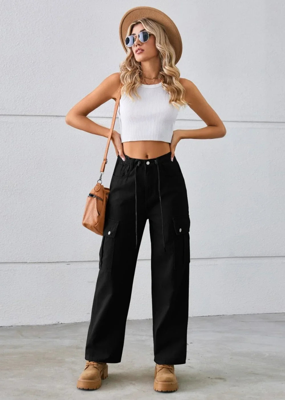Black cargo pants with a drawstring waist and flap pockets on a model.