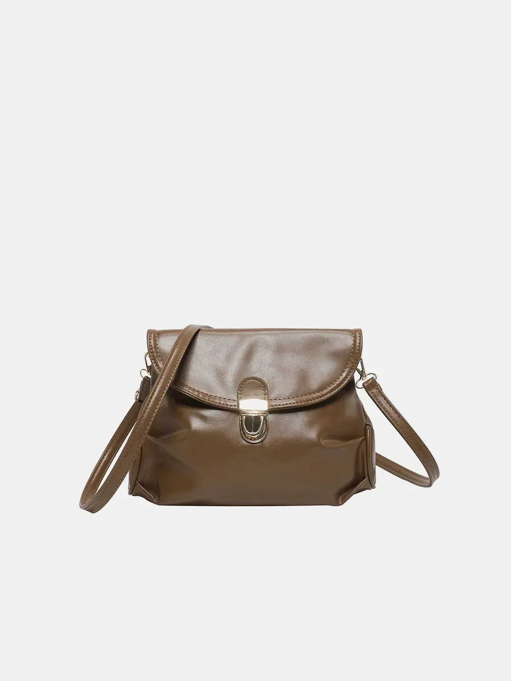 Brown faux leather crossbody bag with a gold clasp closure and adjustable strap, against a white background.