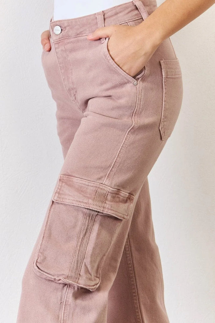 Close-up of dusty rose cargo pants with a high-rise fit and visible stitching detail.