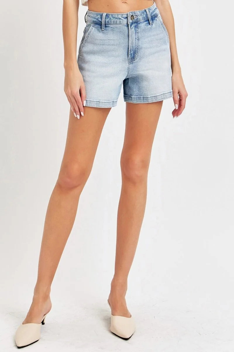 Light wash denim shorts with a regular fit and slight stretch, styled on a model.