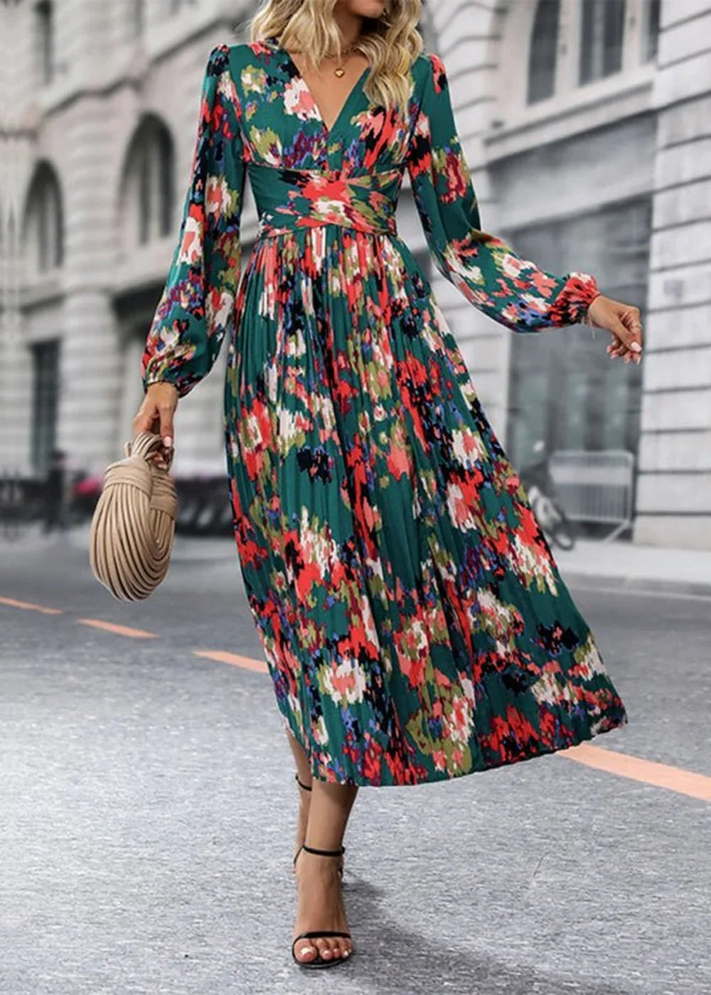 Green floral print midi dress with long sleeves, pleated skirt, and a cinched waist.