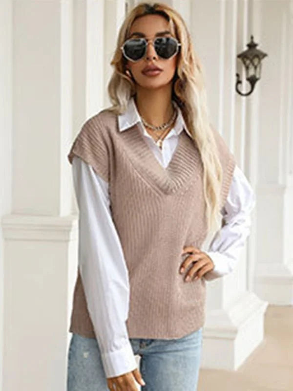 Beige knit V-neck sweater vest layered over a white collared shirt on a model.