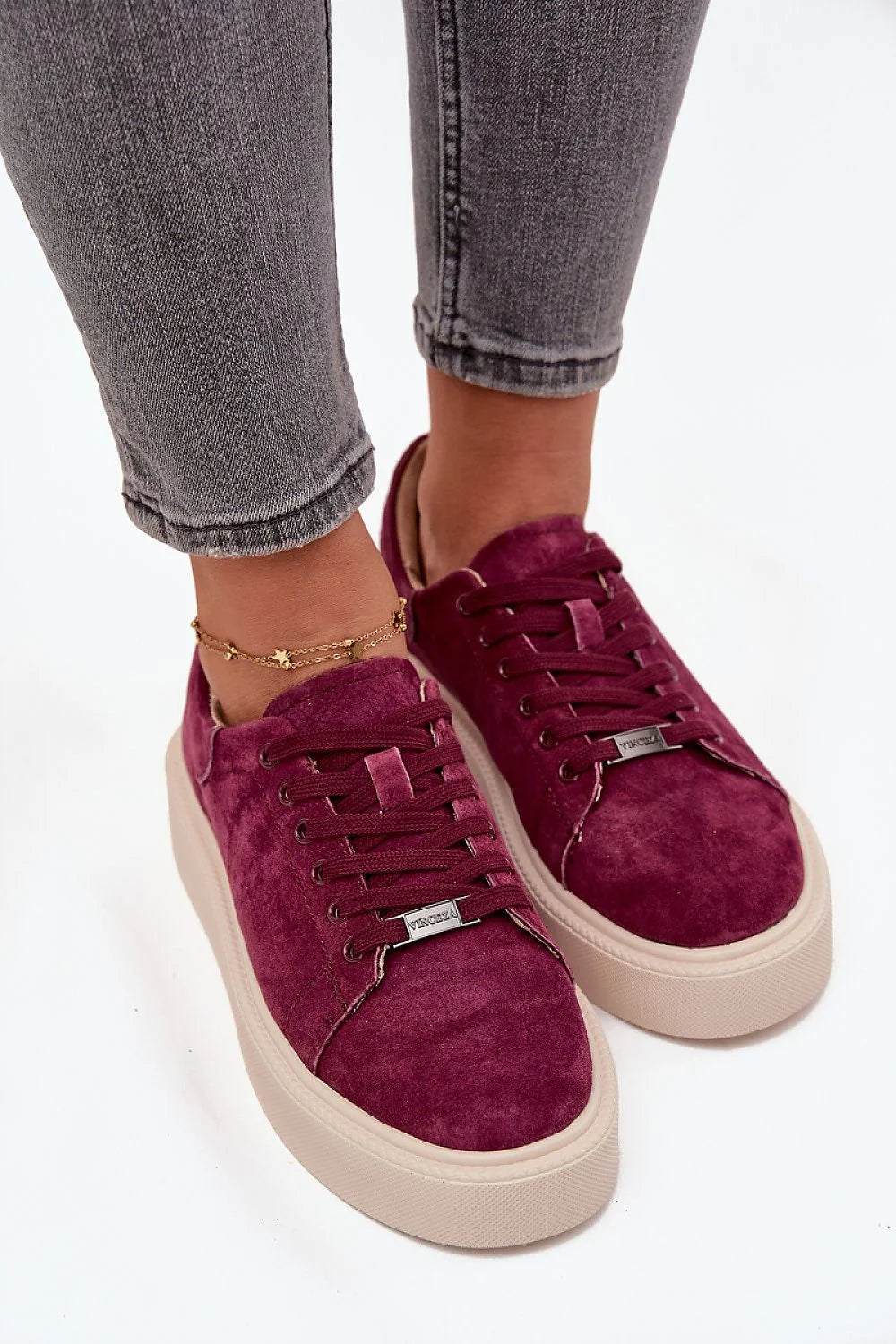 Plum suede sneakers with tan platform soles and gold star anklet on model.