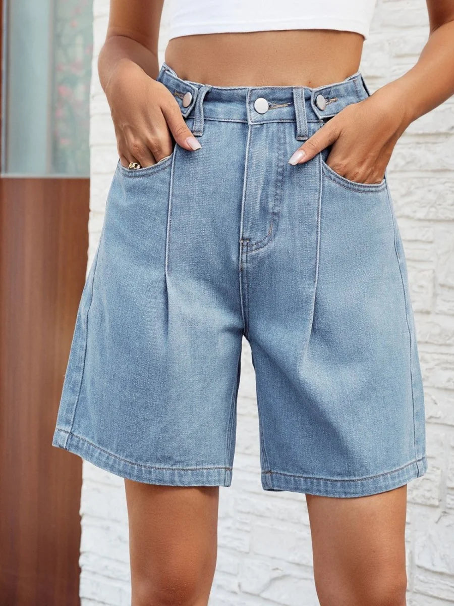 Light blue denim shorts with a relaxed fit, featuring front pleats and deep pockets.
