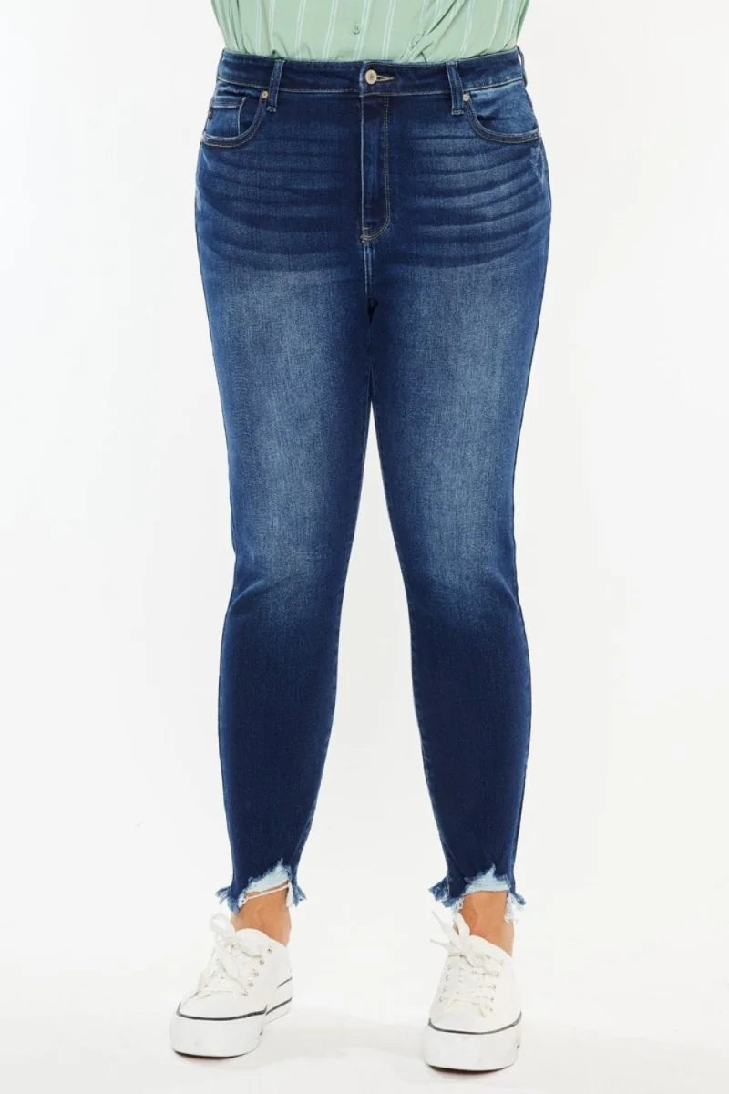 Dark wash denim jeans with a frayed hem and slight stretch fit.