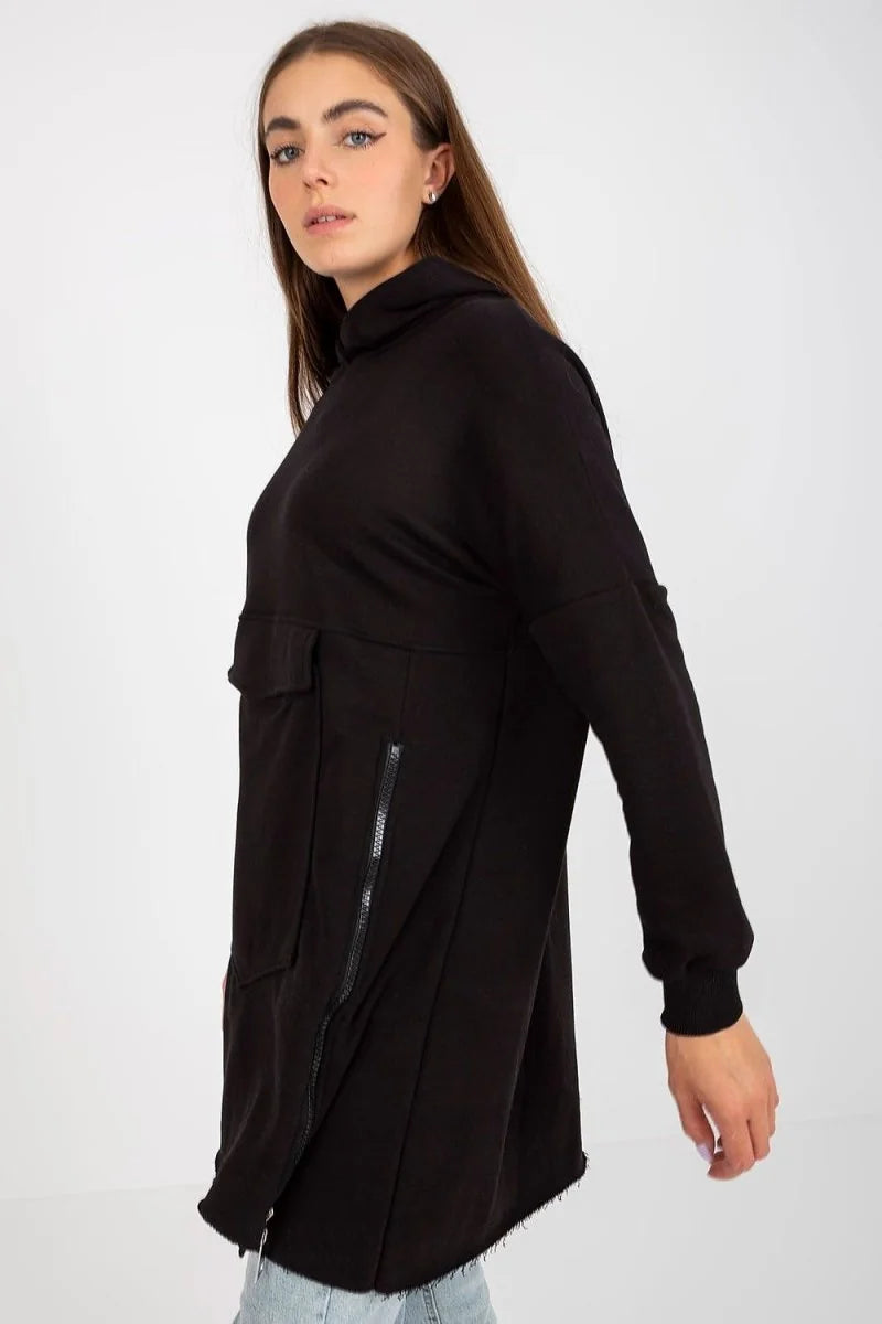 Black cotton tunic with a high neck, zip details, a flap pocket, and a frayed hem.