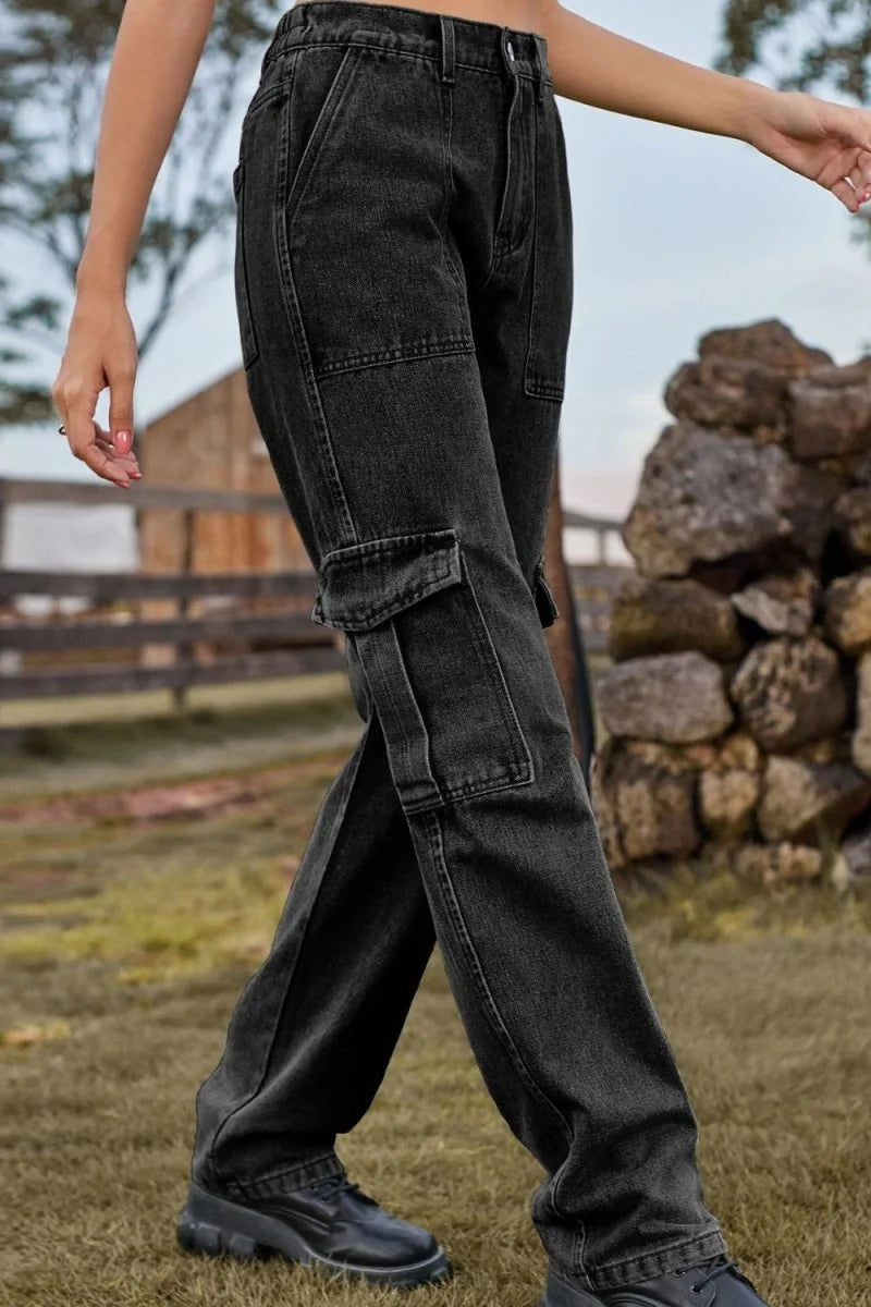 Black denim cargo pants with a regular fit, featuring large side pockets and a textured look.