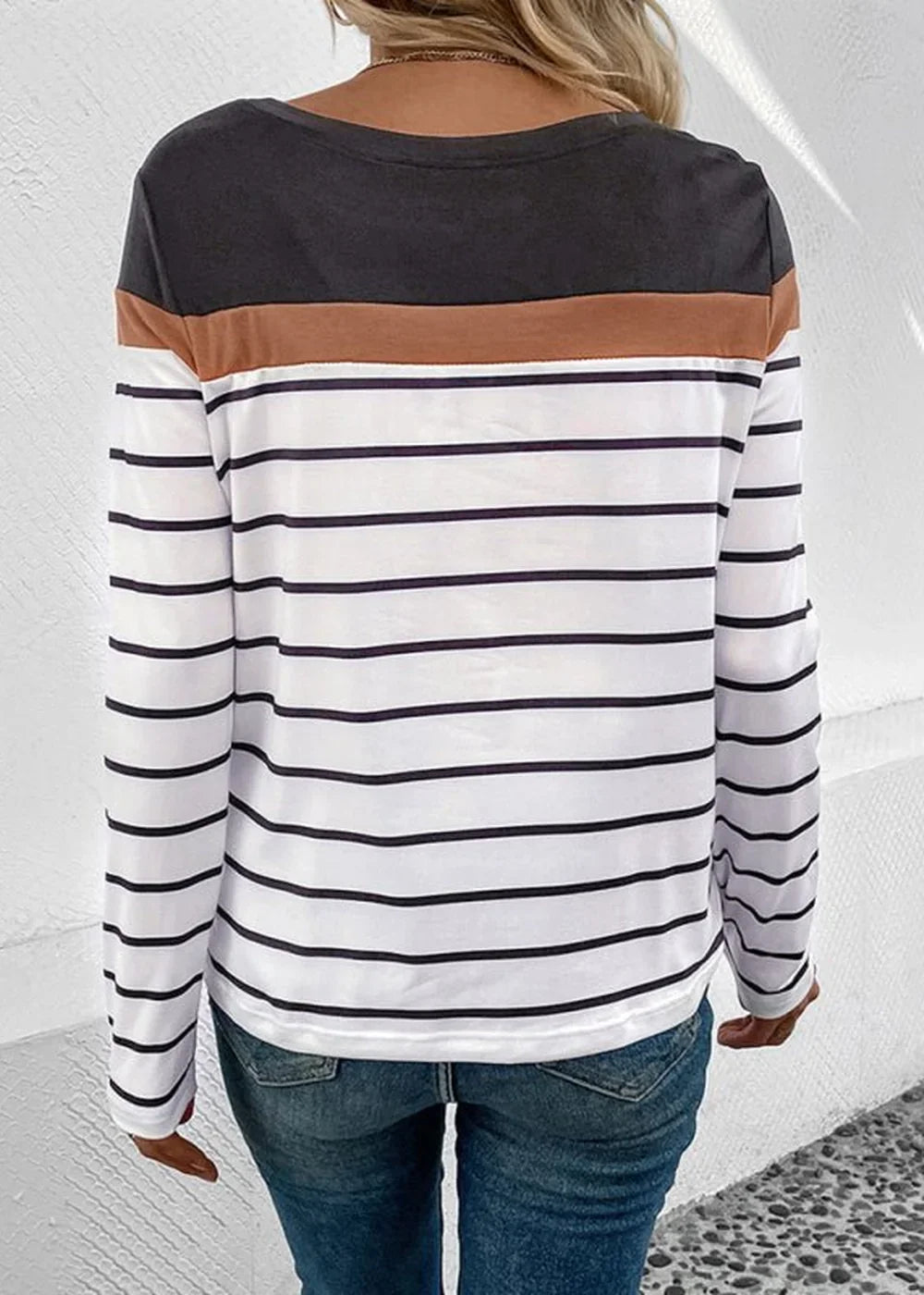 Back view of a long-sleeved striped top with brown and charcoal accents.