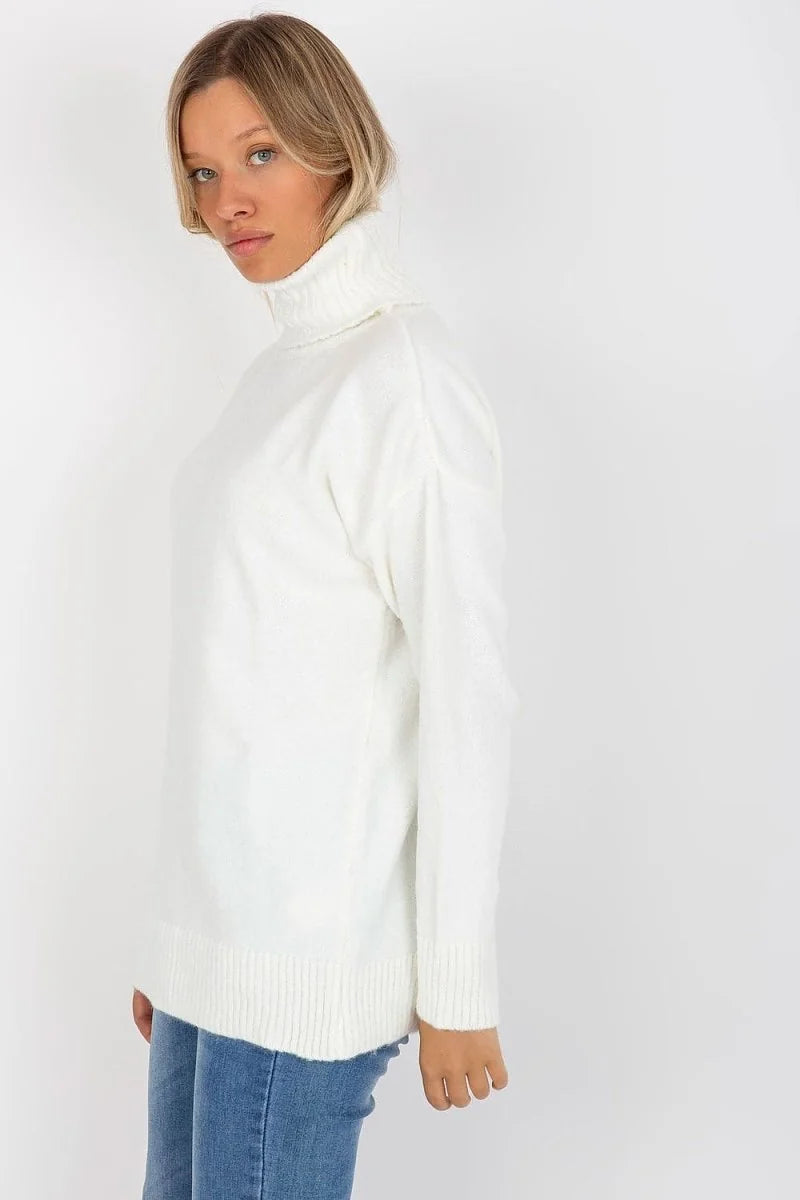 Cream white turtleneck sweater with ribbed trim, worn by a model with blonde hair.