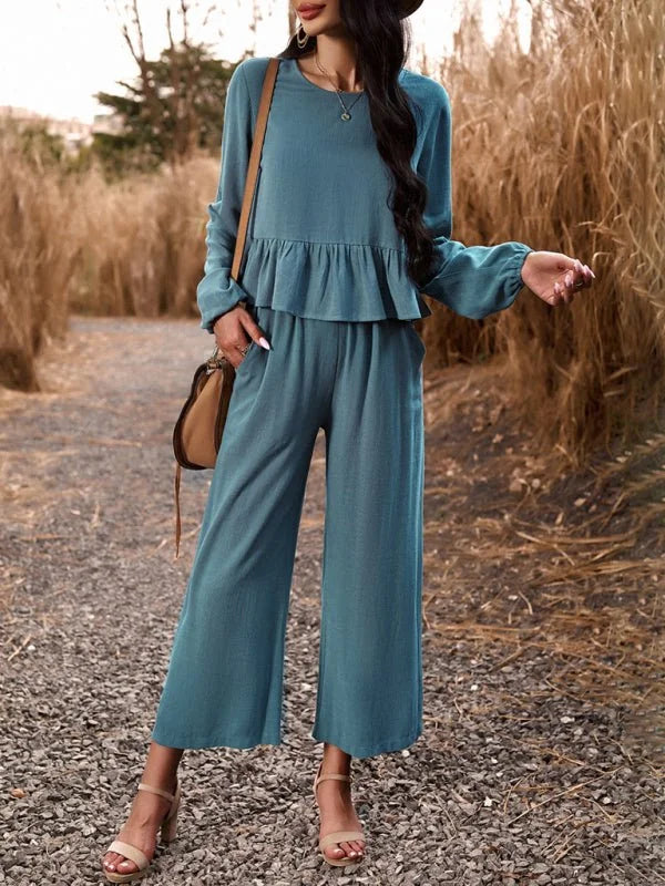 Teal linen-blend pant suit with tiered ruffle top and wide-leg pants on a model.