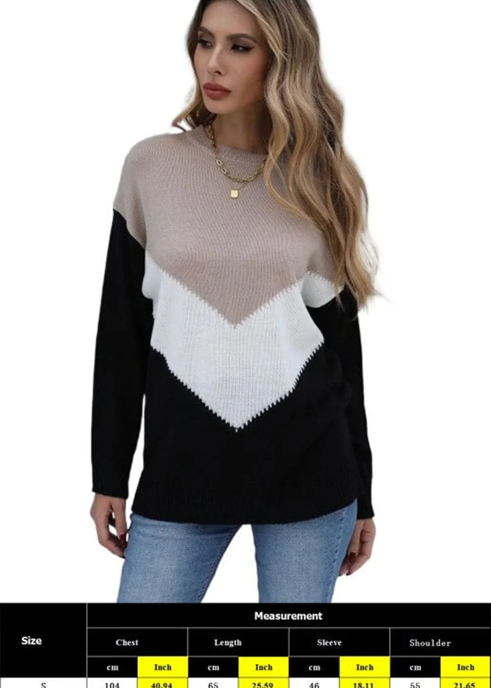 Relaxed fit beige, white, and black colorblock sweater with dropped shoulders.