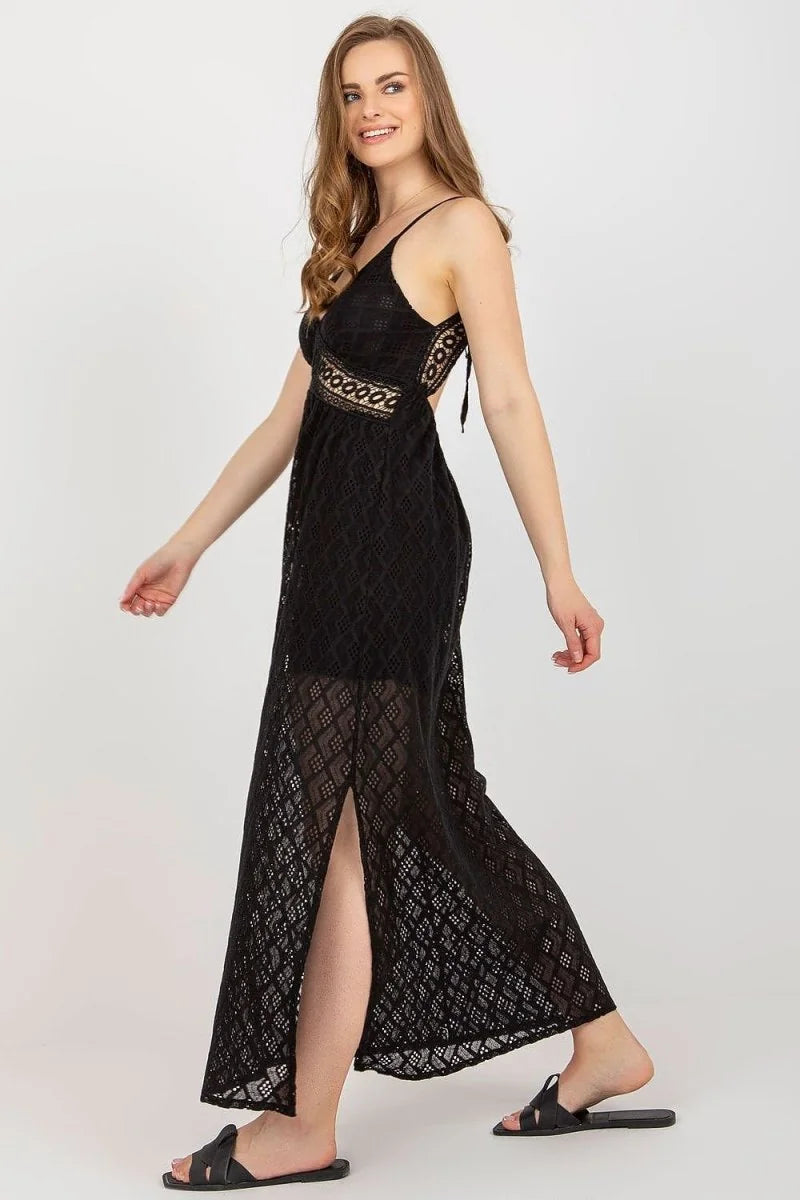 Black lace maxi dress with a V-neck, side slit, and tie-back detail.