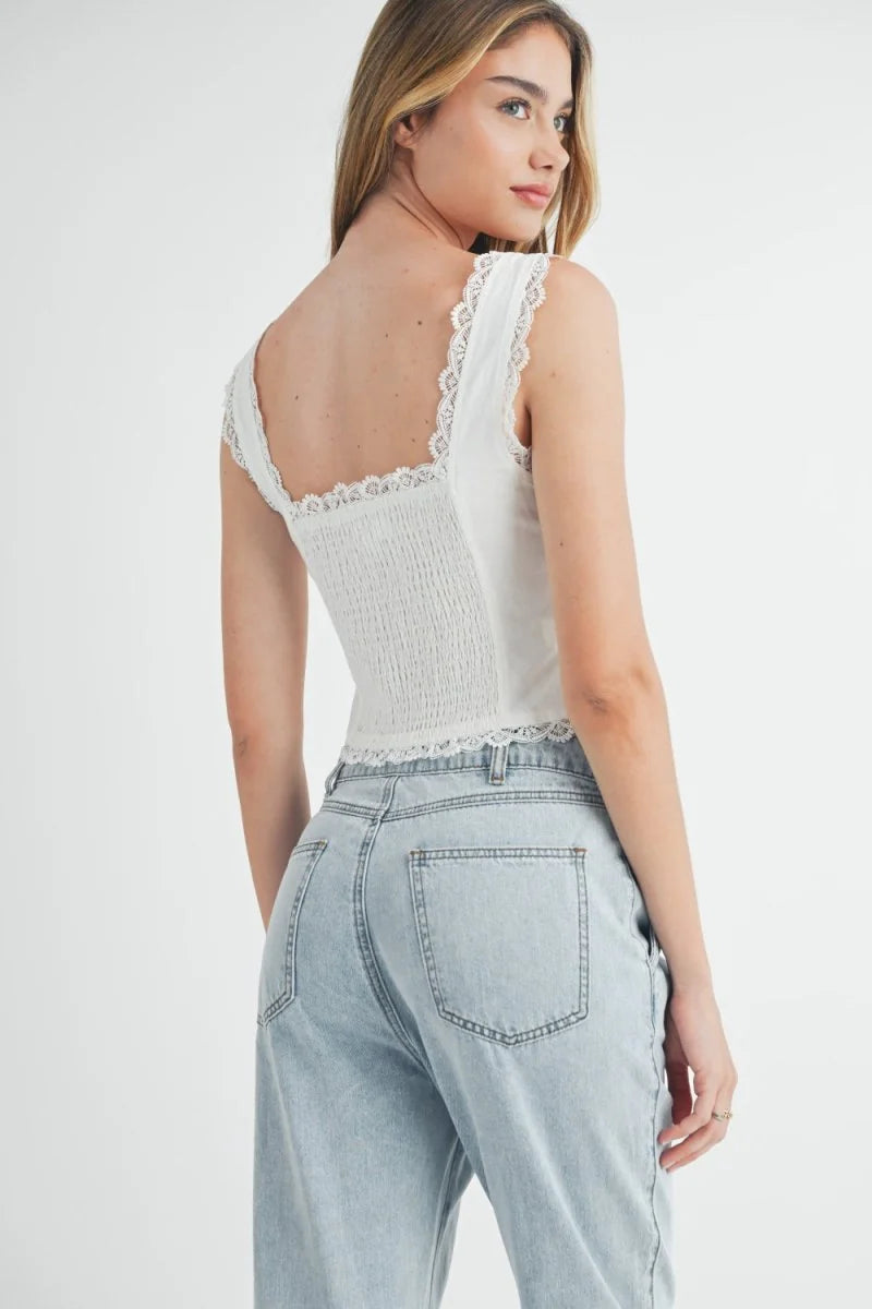 Light wash denim jeans with a relaxed fit and visible pocket details.
