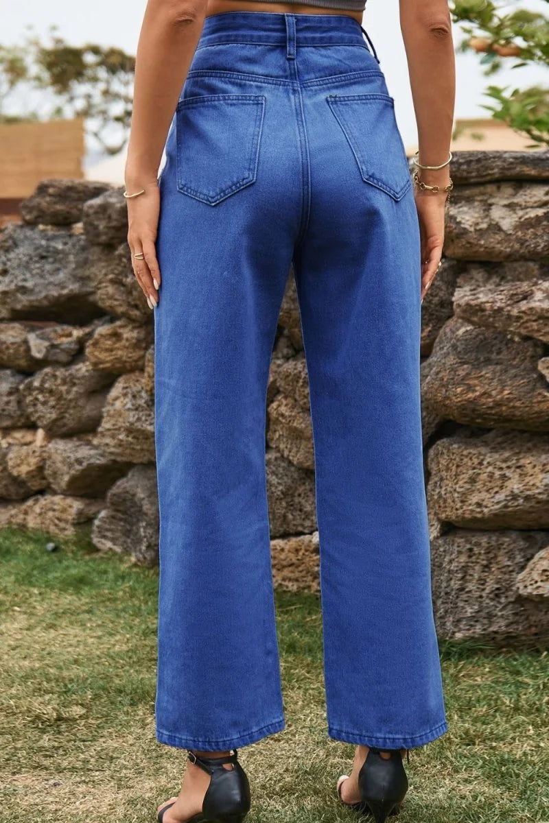 Back view of wide-leg, royal blue denim jeans with a regular fit, showing the pockets and hem.