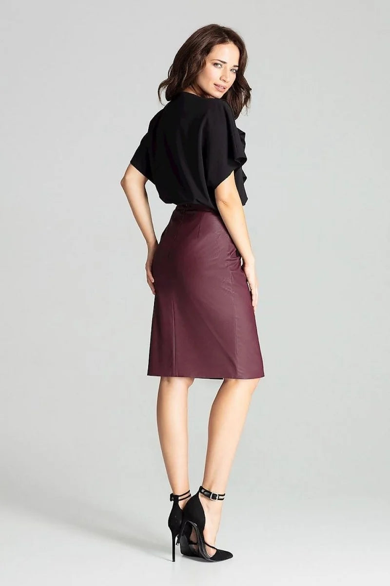 Burgundy faux leather midi skirt with a regular fit, shown on a model.