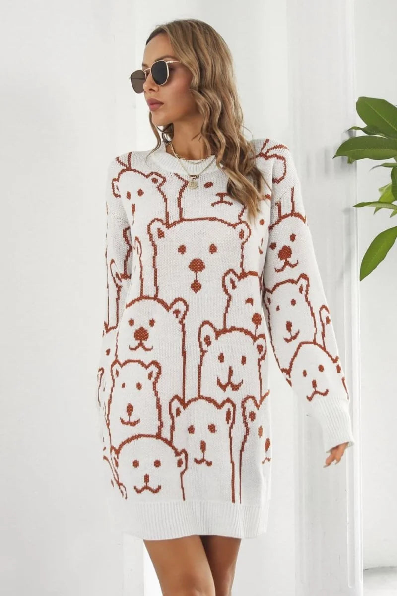 White sweater dress with all-over brown bear print and crew neck, on a model.