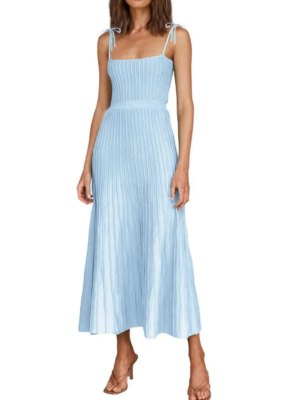 Light blue ribbed knit midi dress with tie straps and a pleated skirt, worn by a model.