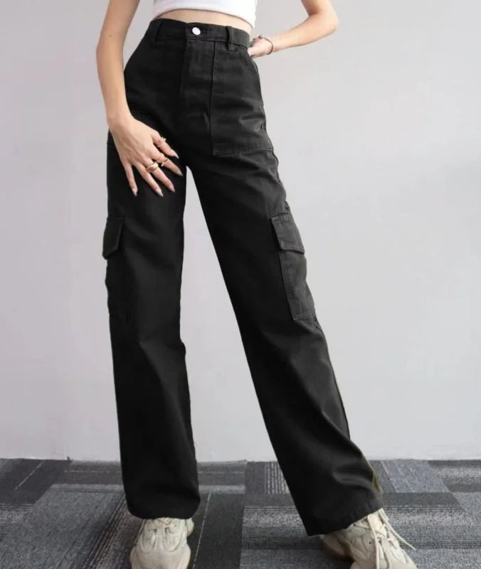 Black relaxed fit cargo pants with large side pockets, on model.