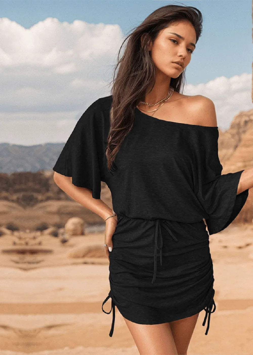 Black off-the-shoulder dress with drawstring ruched skirt and flutter sleeves.