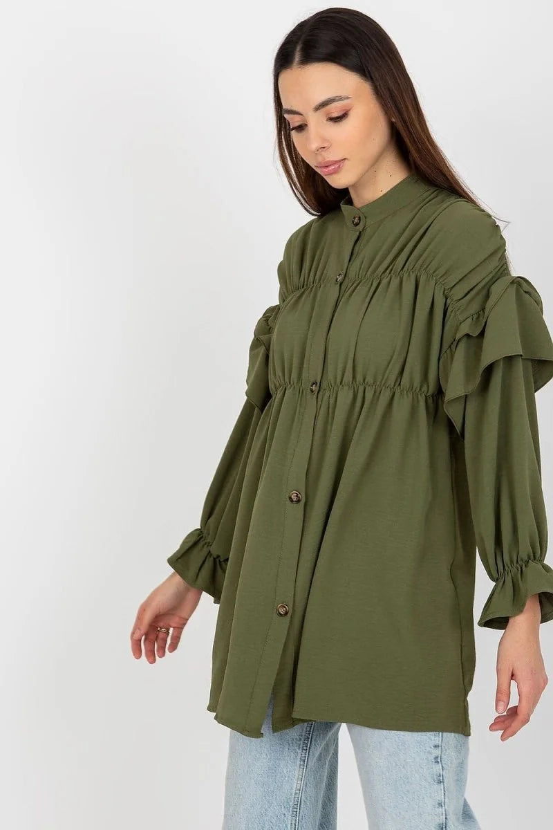 Khaki green tunic with ruffled sleeves and button-down front, loose fit on model.