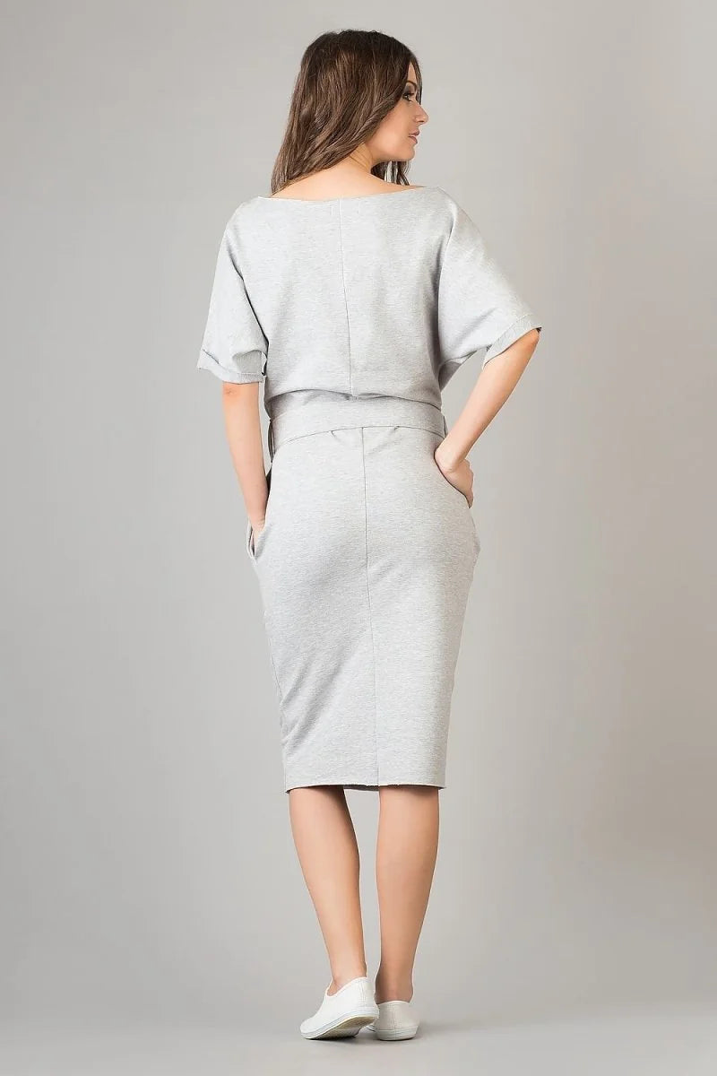 Back view of a relaxed-fit, light gray cotton blend dress with short sleeves and a belted waist.