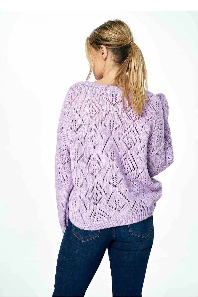 Lavender open-knit diamond pattern sweater with a regular fit, worn with dark wash denim jeans.