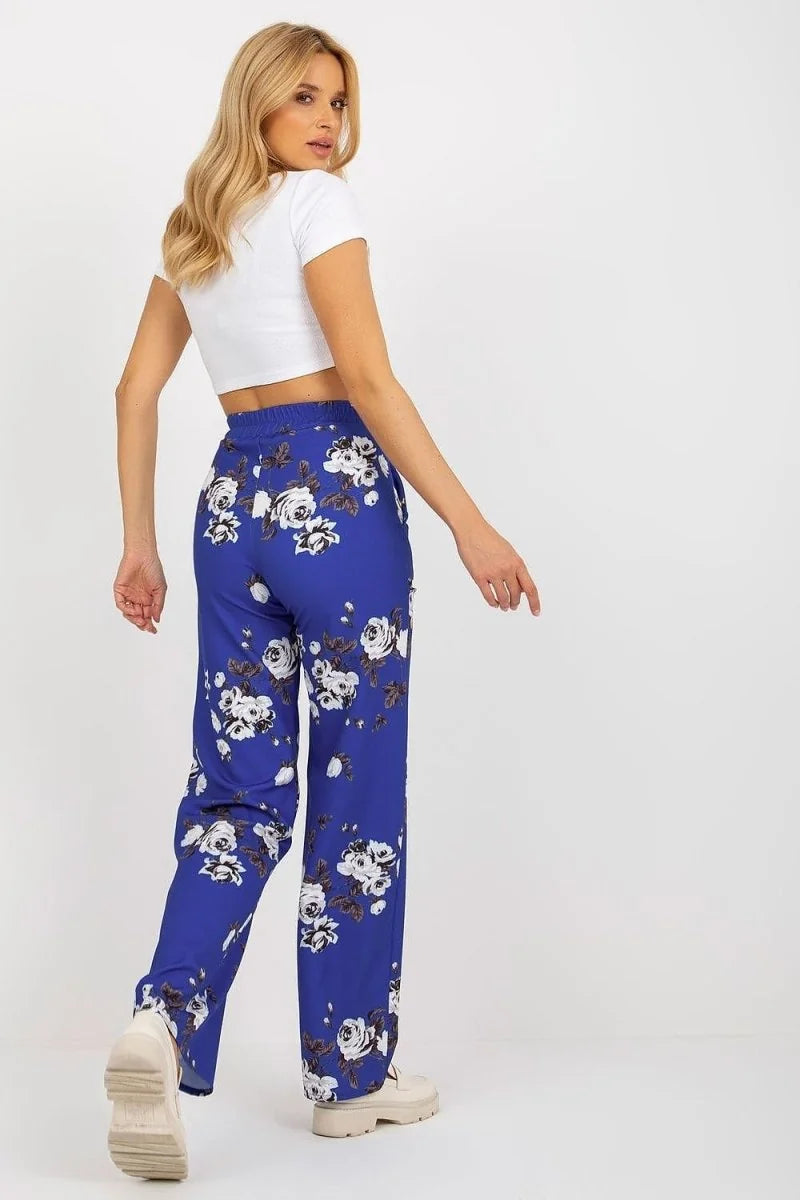 Blue floral wide-leg pants on a model, showing a relaxed fit and casual style.