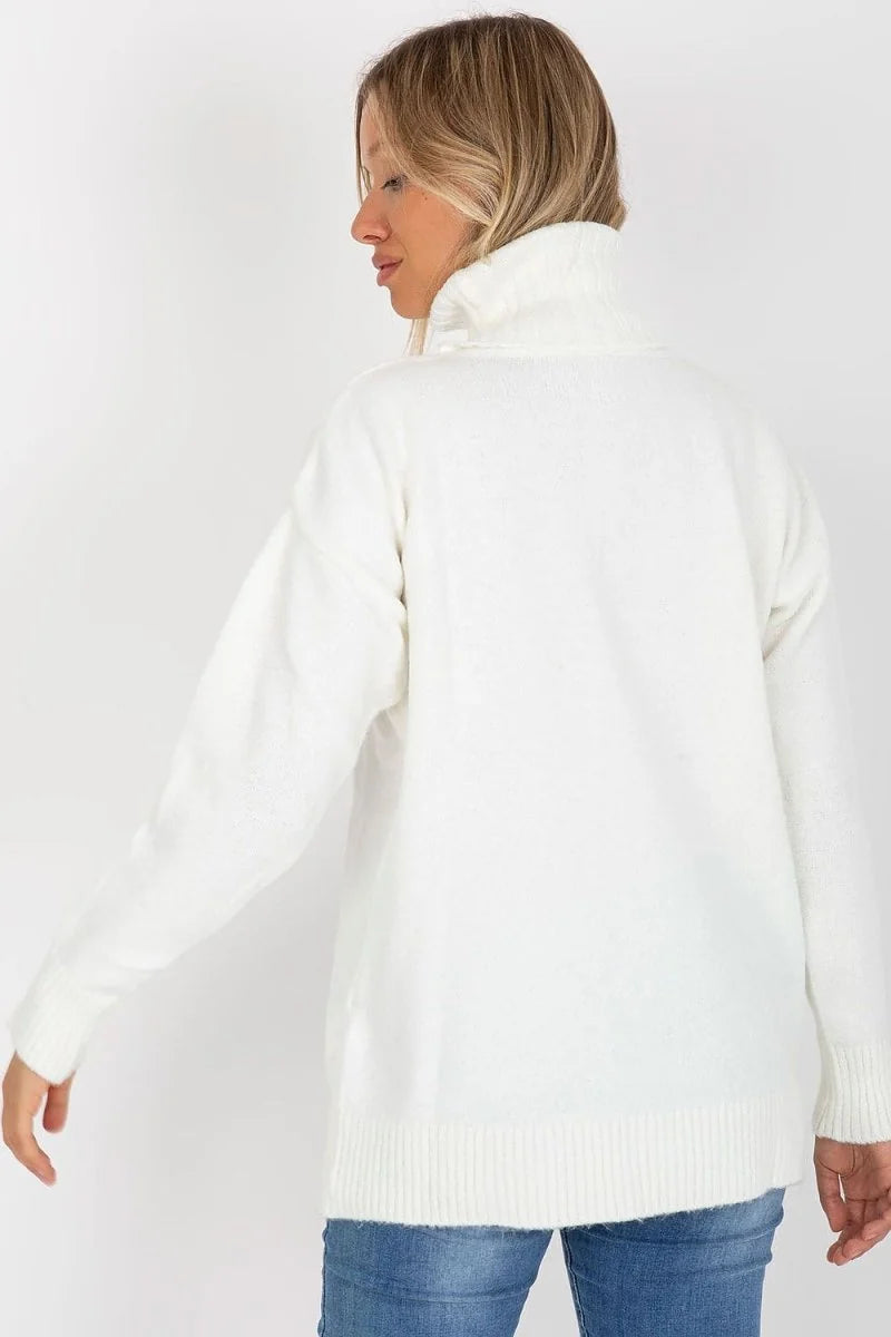White fuzzy turtleneck sweater with ribbed cuffs and hem, on model.
