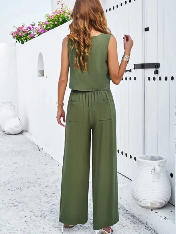 Women's olive green wide-leg pant suit with cropped sleeveless top and pockets, shown from the back.