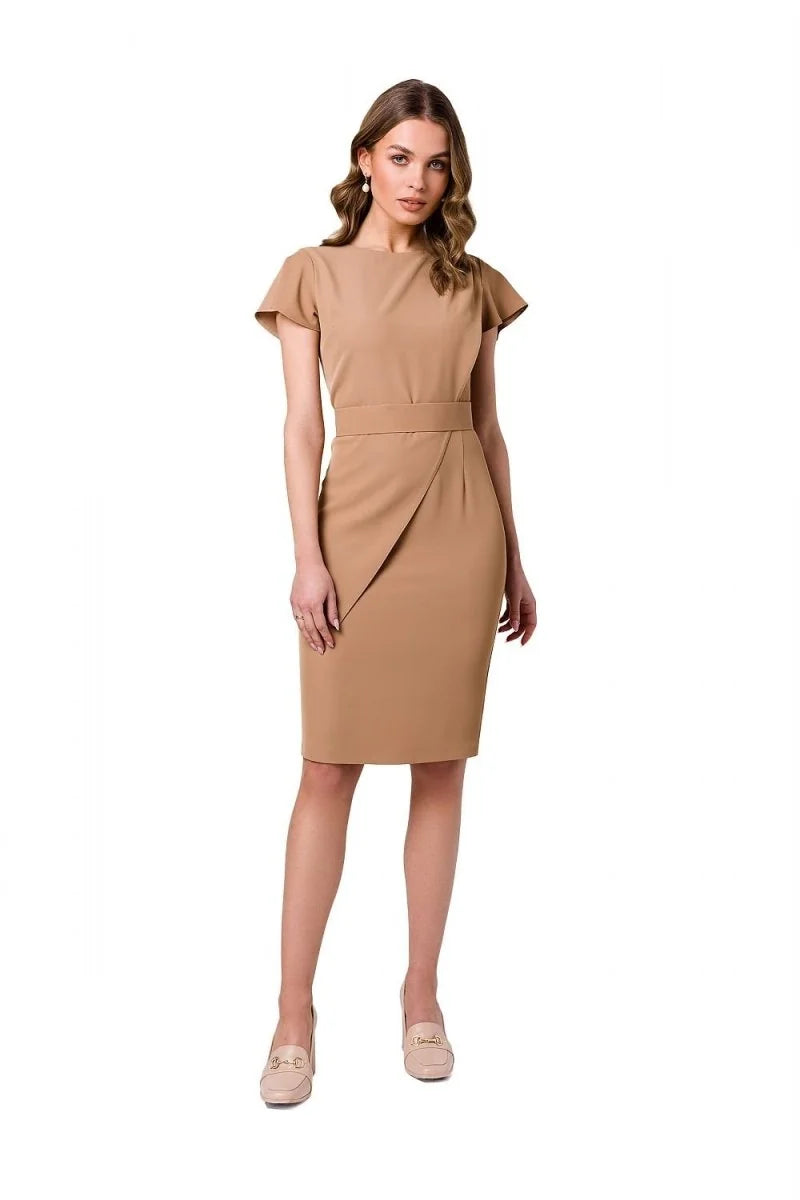 A camel-colored sheath dress with cap sleeves and a tulip skirt, worn by a model.