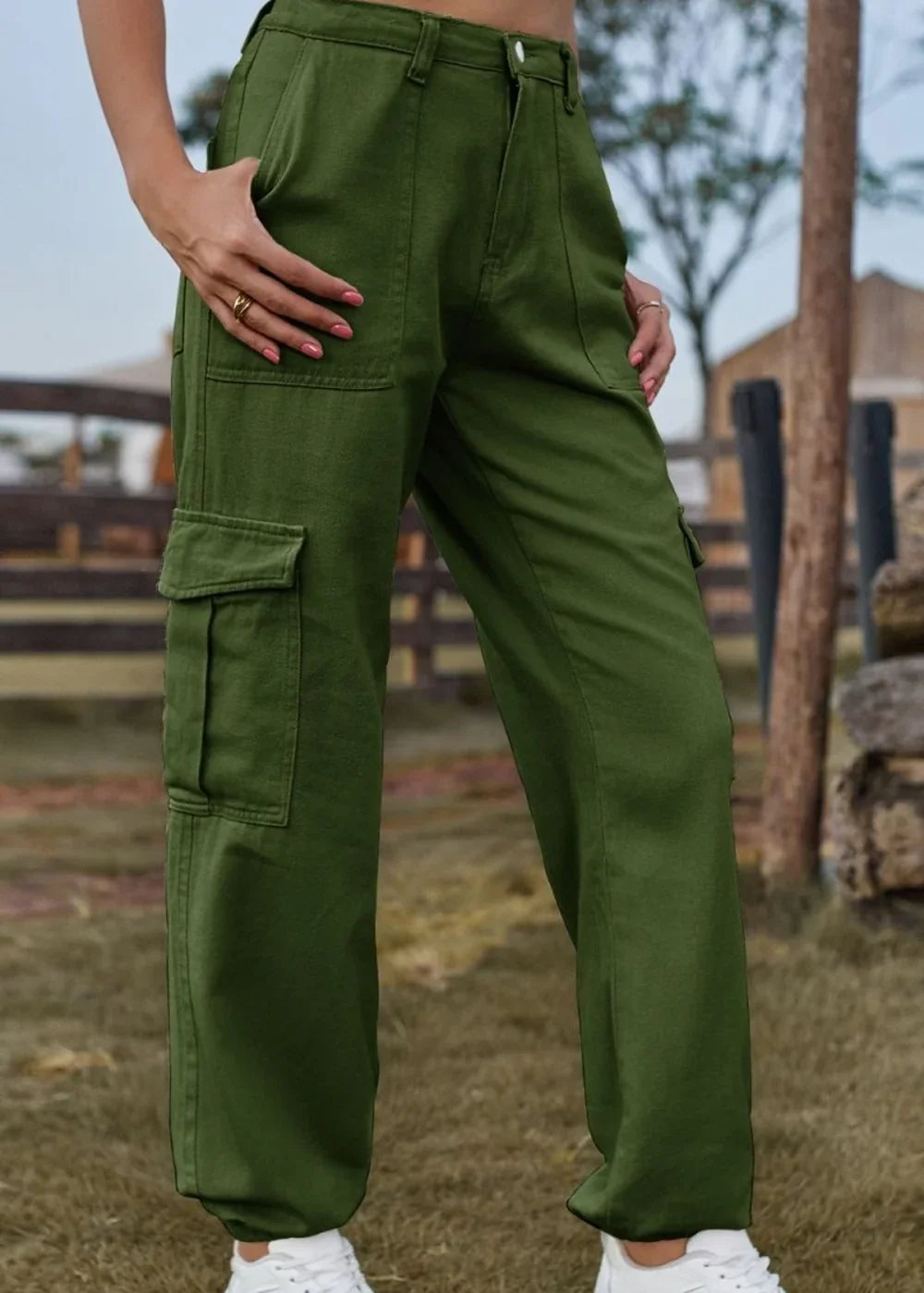 Olive green cargo pants with multiple pockets, regular fit, on model.