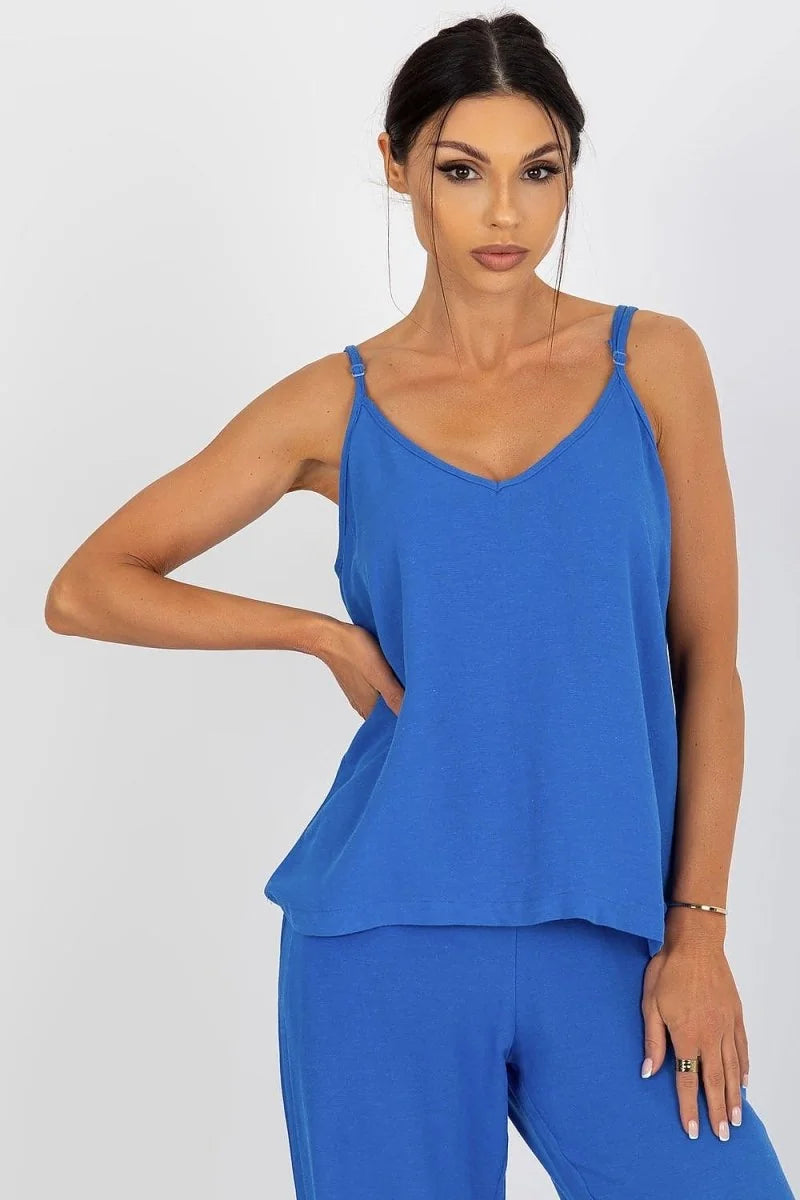 Loose-fitting royal blue V-neck camisole with adjustable straps, worn by a model.