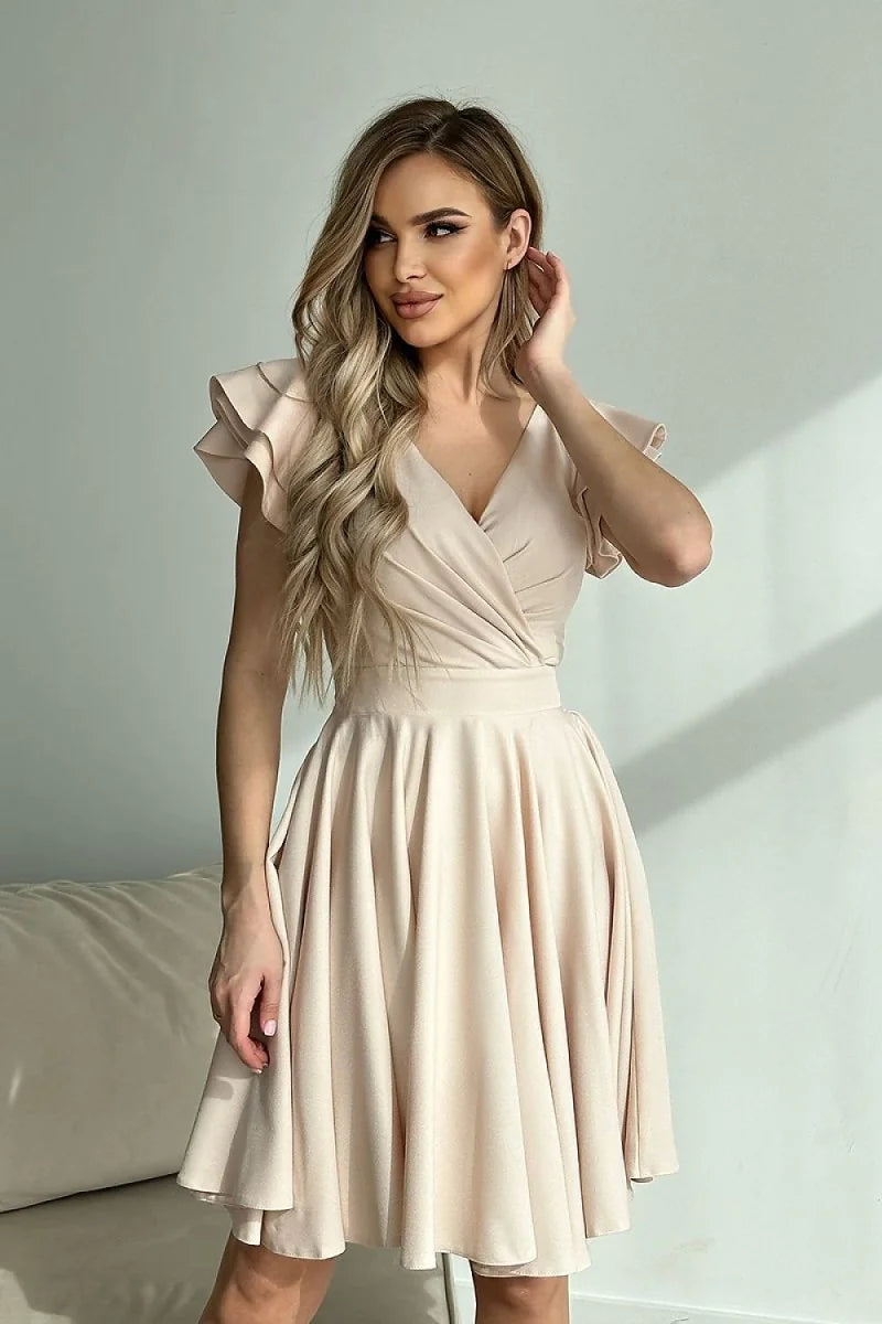 Cream V-neck wrap dress with ruffled short sleeves and a full, flowing skirt.