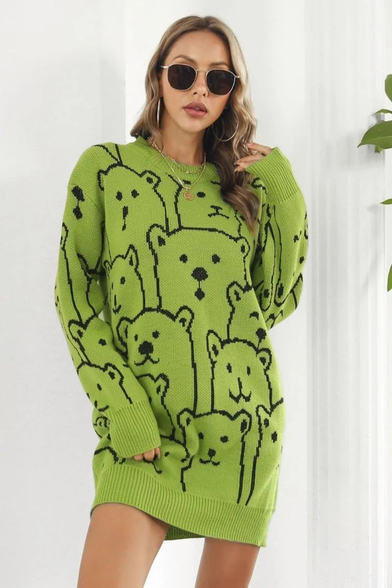 Lime green acrylic sweater dress with a black all-over teddy bear pattern, long sleeves, and a crew neck.