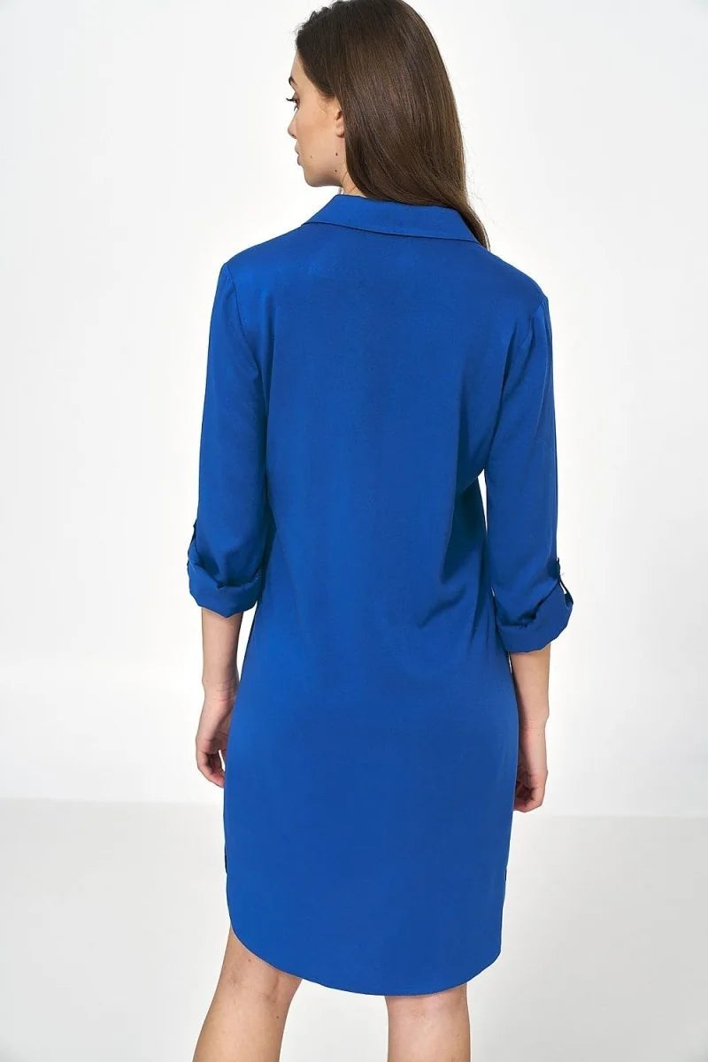 Back view of a vibrant royal blue oversized viscose dress with cuffed sleeves.