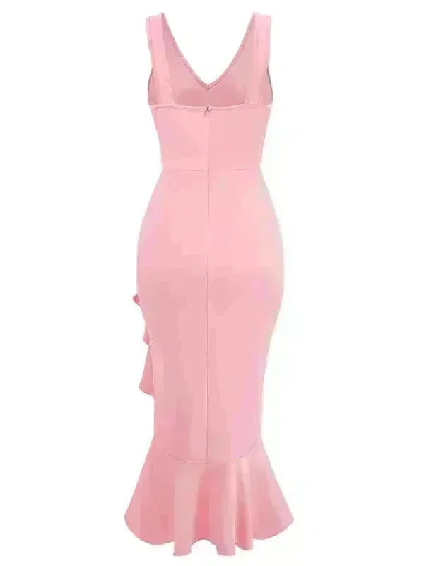 Pink mermaid dress with ruffled hem and side ruffle detail, showing back view.
