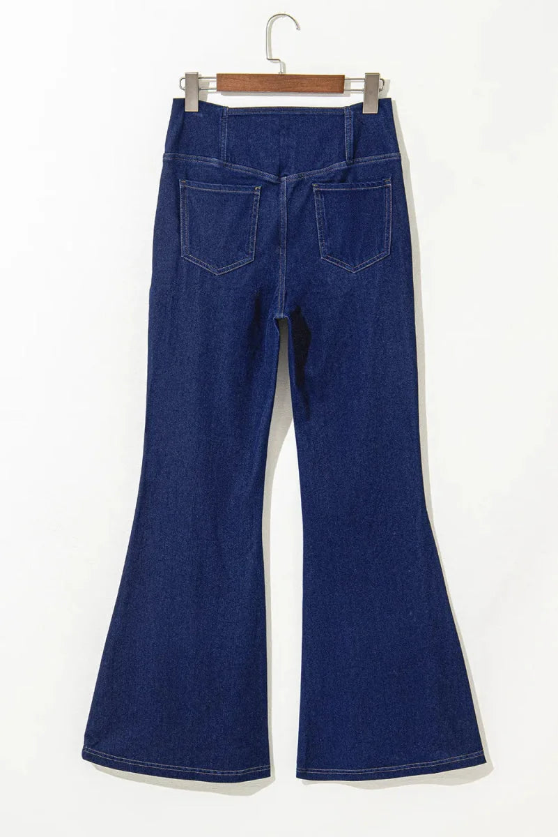 Dark wash flare jeans with a high waist and two back pockets, showing moderate stretch.