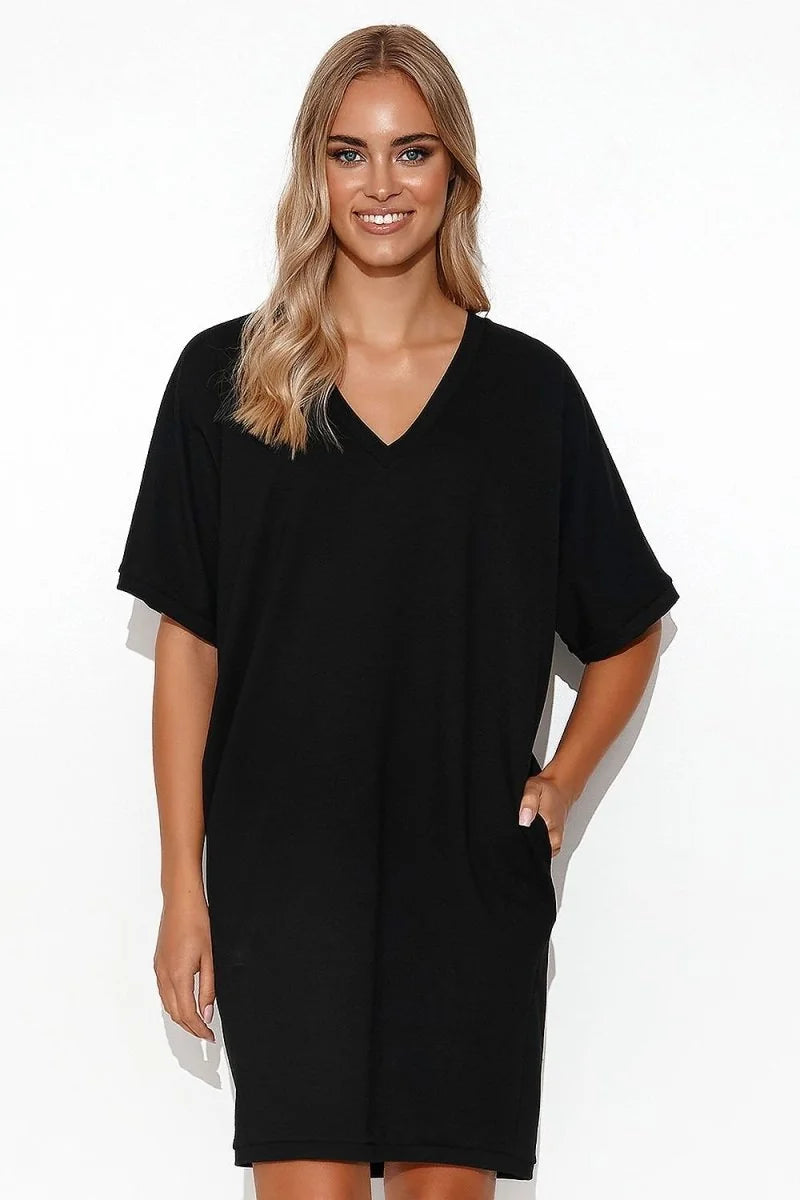 Black V-neck t-shirt dress with short sleeves and pockets, worn by a model.