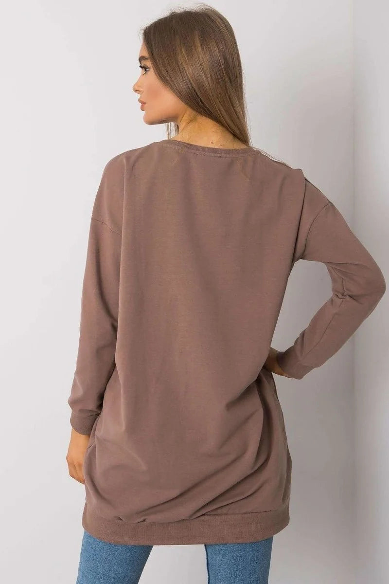 Loose-fitting mocha long-sleeve top with a cinched hem, shown from the back on a model.